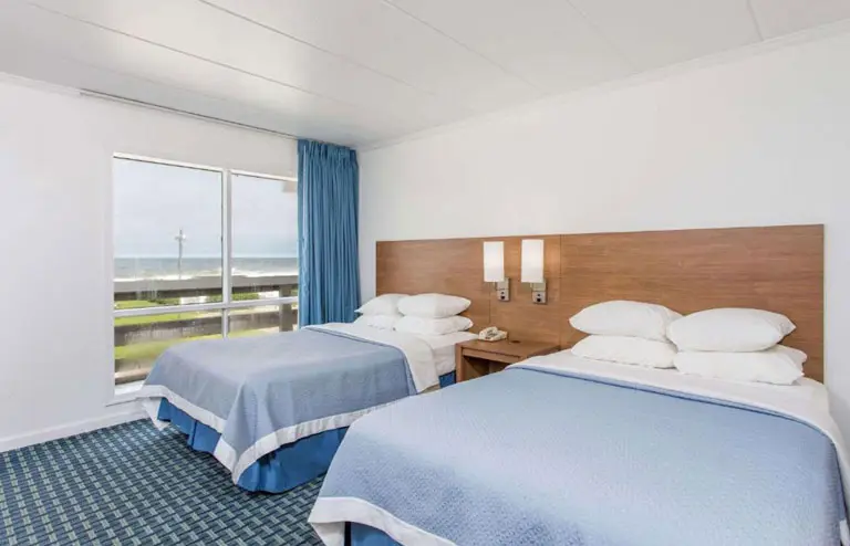 Two double beds in an ocean-view room at Mariner Inn and Suites