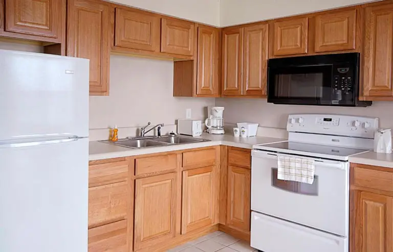 Two queen beds in a kitchen suite at Mariner Inn and Suites