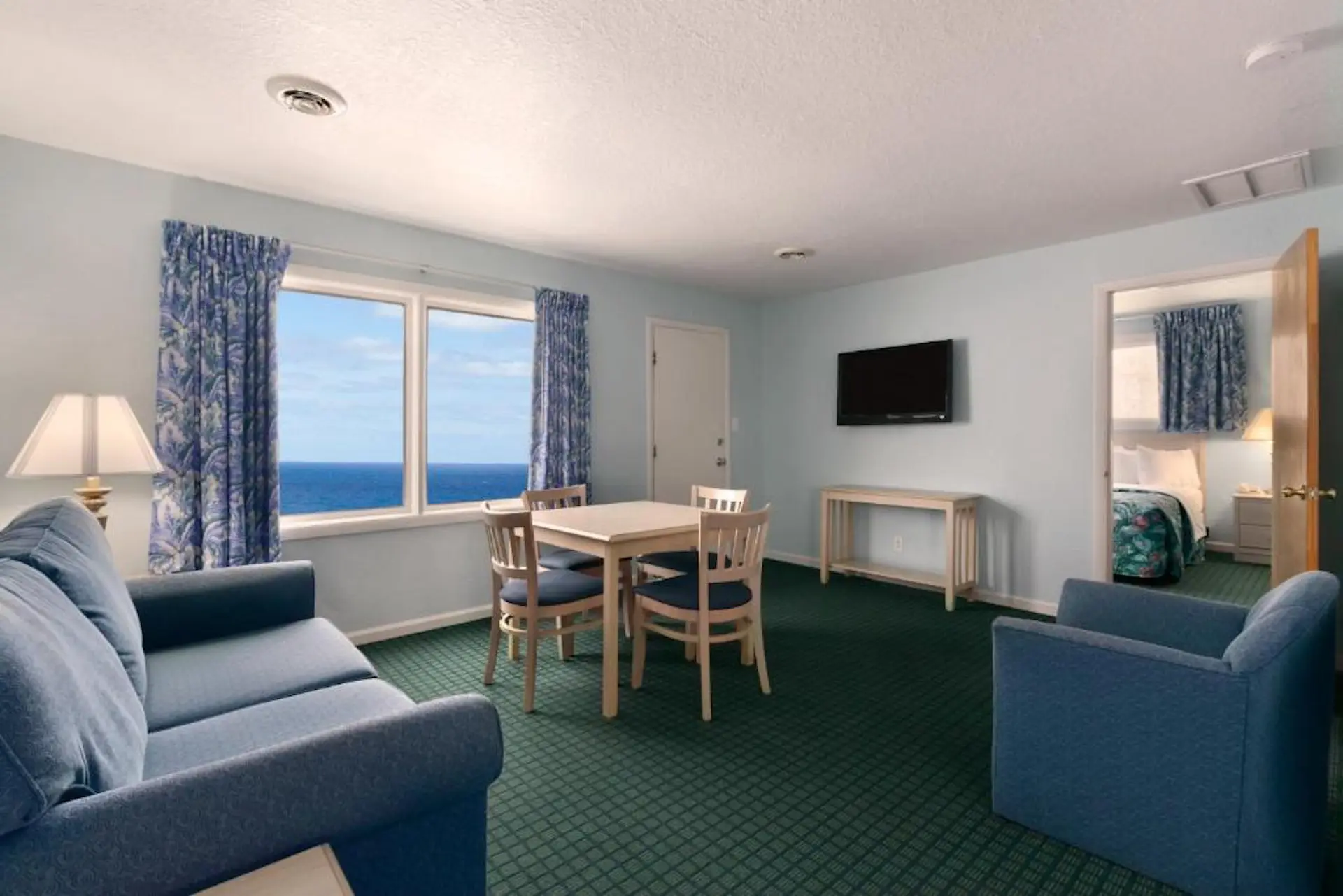 Queen beds in an ocean-view suite at Mariner Inn and Suites